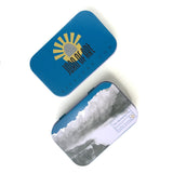 The Sketching Tin lid is illustrated with a sketch of the Sunshine Coast in BC, Canada. The base is emblazoned with the logo of Joan of Art.